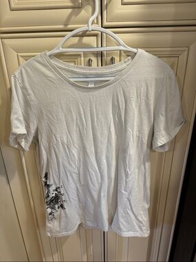 And Now This White Crew Neck Tee with Subtle Black Floral Accent
